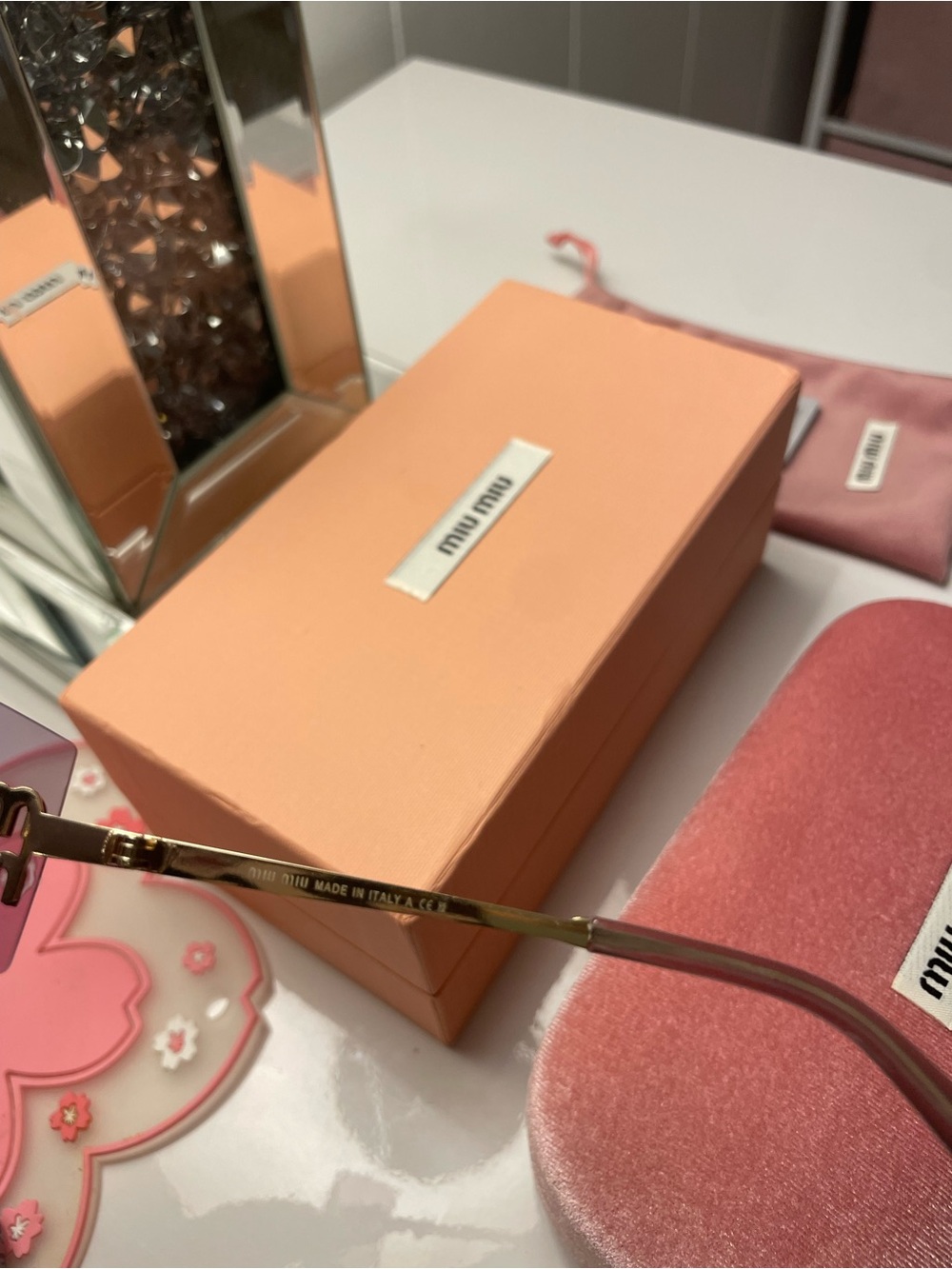 Miu Miu Rimless Rectangular Sunglasses in Rose Pink with Gold Accents - Picture 4 of 5